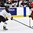 KAMLOOPS, BC - APRIL 1: Switzerland's Dominique Ruegg #26 plays the puck while Japan's Sena Suzuki #6 defends during relegation round action at the 2016 IIHF Ice Hockey Women's World Championship. (Photo by Matt Zambonin/HHOF-IIHF Images)
